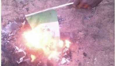 Northern Youths Burn Flag to Protest Hardship