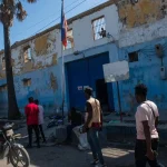 Haitians outside the national penitentiary in Port-au-Prince on Sunday, after an attack by armed gangs.Credit...Johnson Sabin/EPA, via Shutterstock