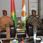 Burkina Faso’s Captain Ibrahim Traore (L) sit next to Niger’s General Abdourahamane Tiani (R) upon his arrival in Niamey on July 5, 2024.